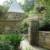 These beautiful natural stone entry walls with a wrought iron gate and a Bluestone walkway and patio at a private residence.  
 

